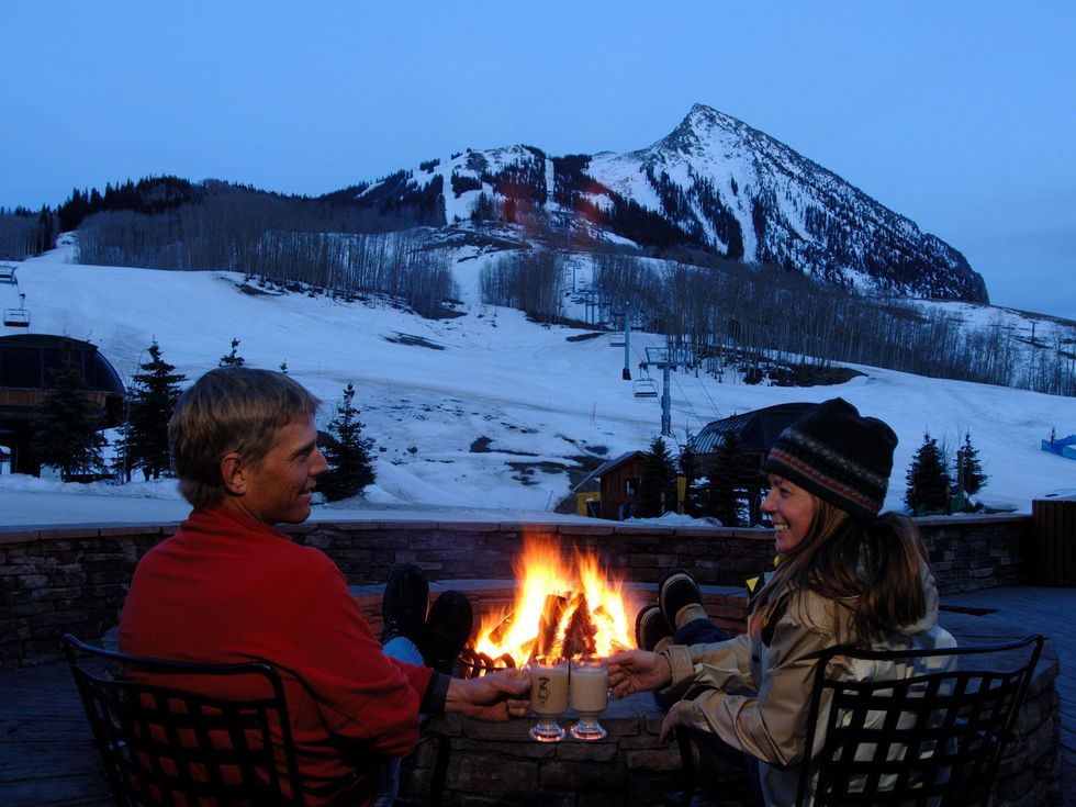 4 Promoted Article No. 1 Elevation Hotel & Spa January 2014 couple outside with fire and mountain