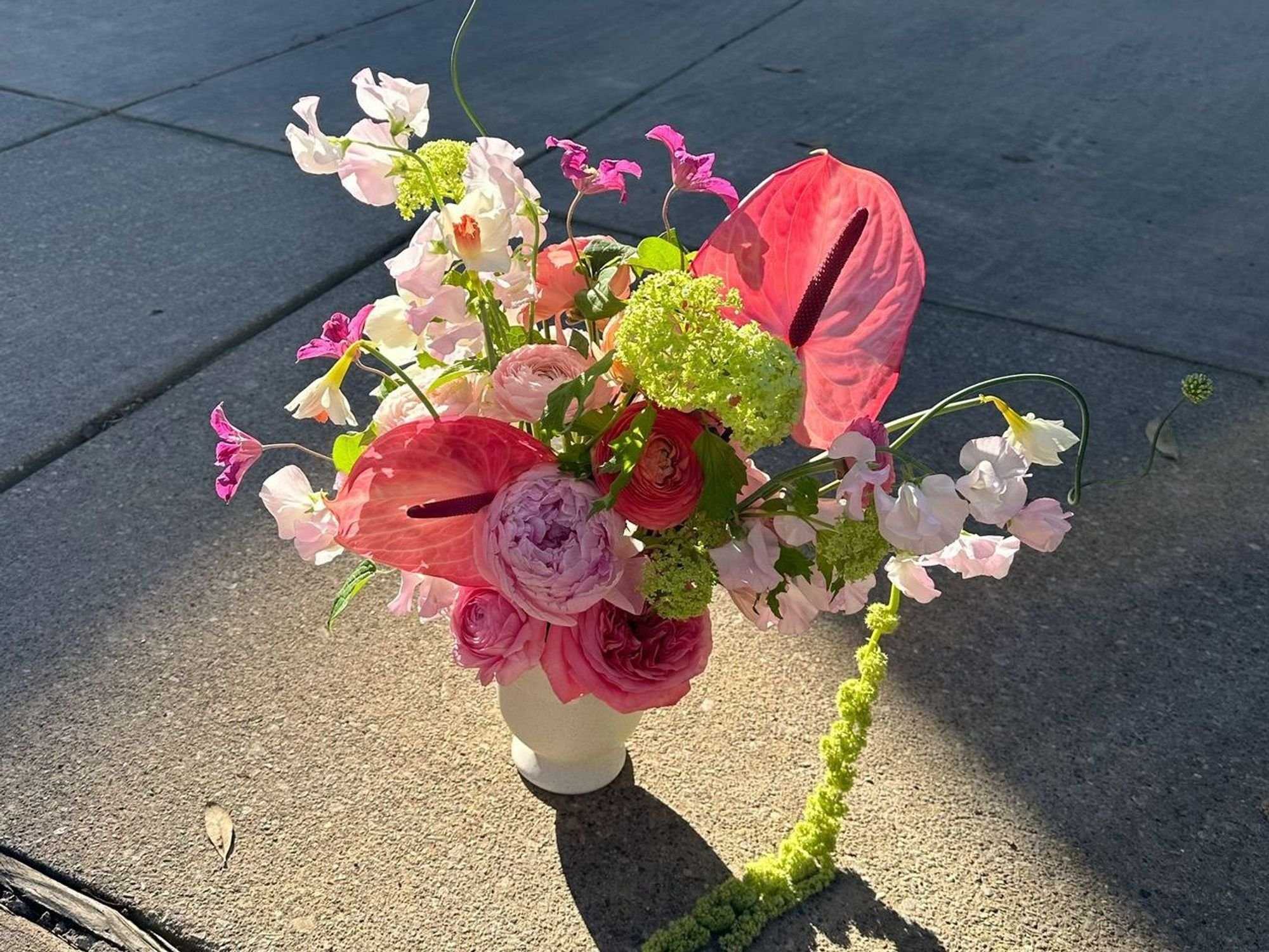 A bouquet of flowers on concrete