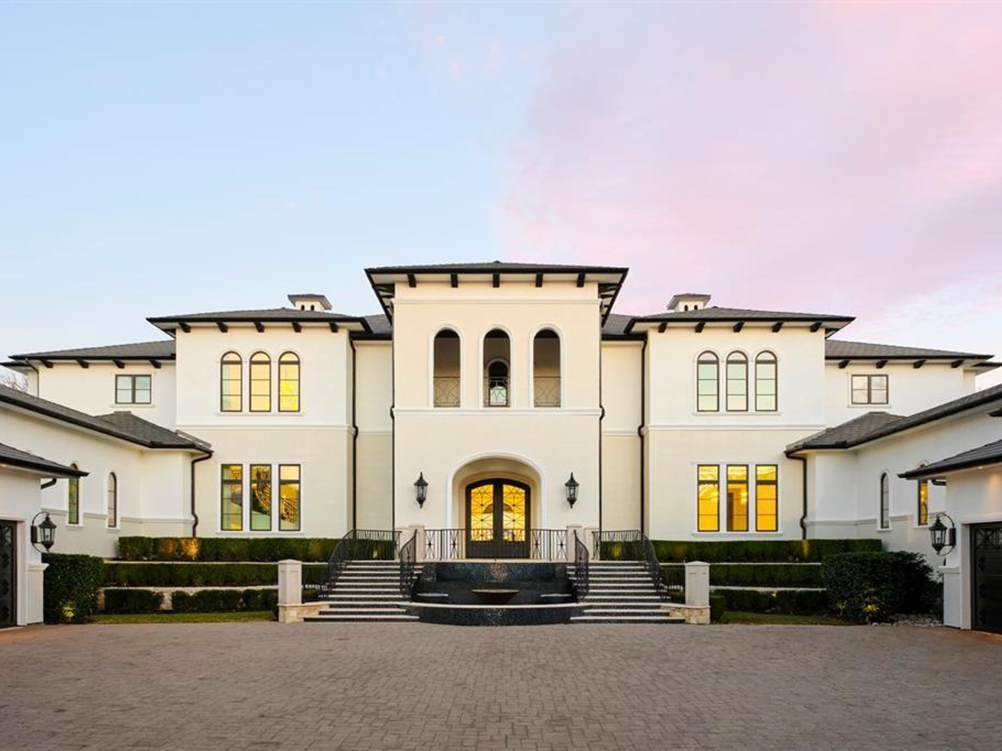 A wide-angle view of the transitional Mediterranean mansion at 1469 Sunshine Lane.