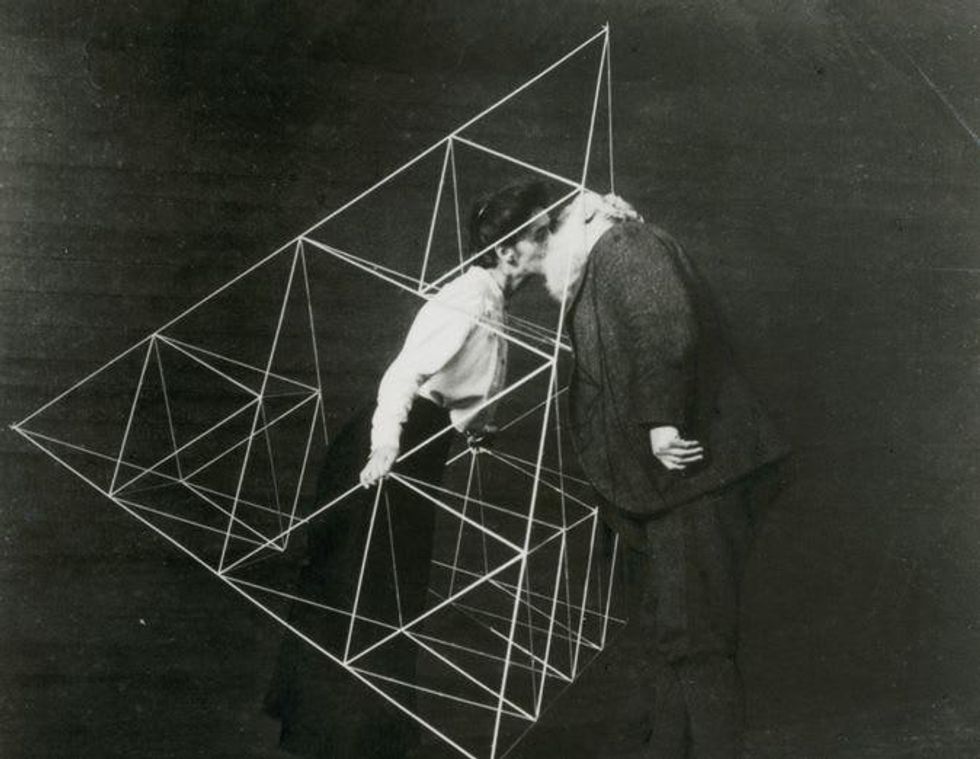 Alexander Graham Bell kisses his wife