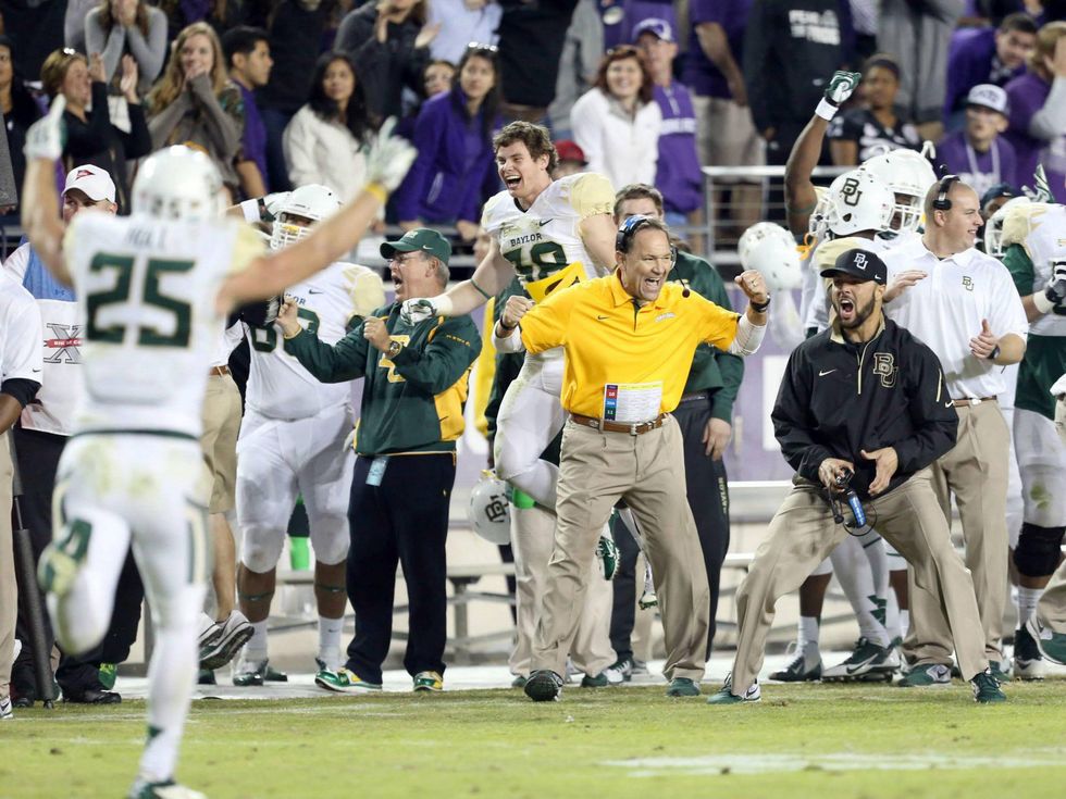 Baylor Bears football players celebrate on sidelines