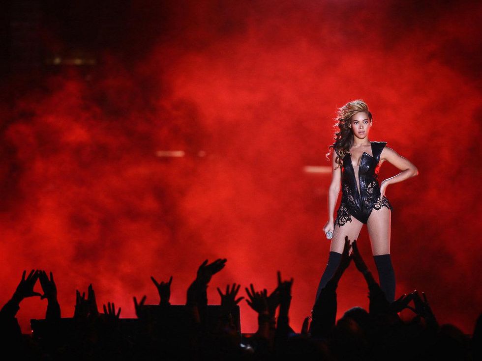 Beyonce, Super Bowl, on stage, red background, February 2013