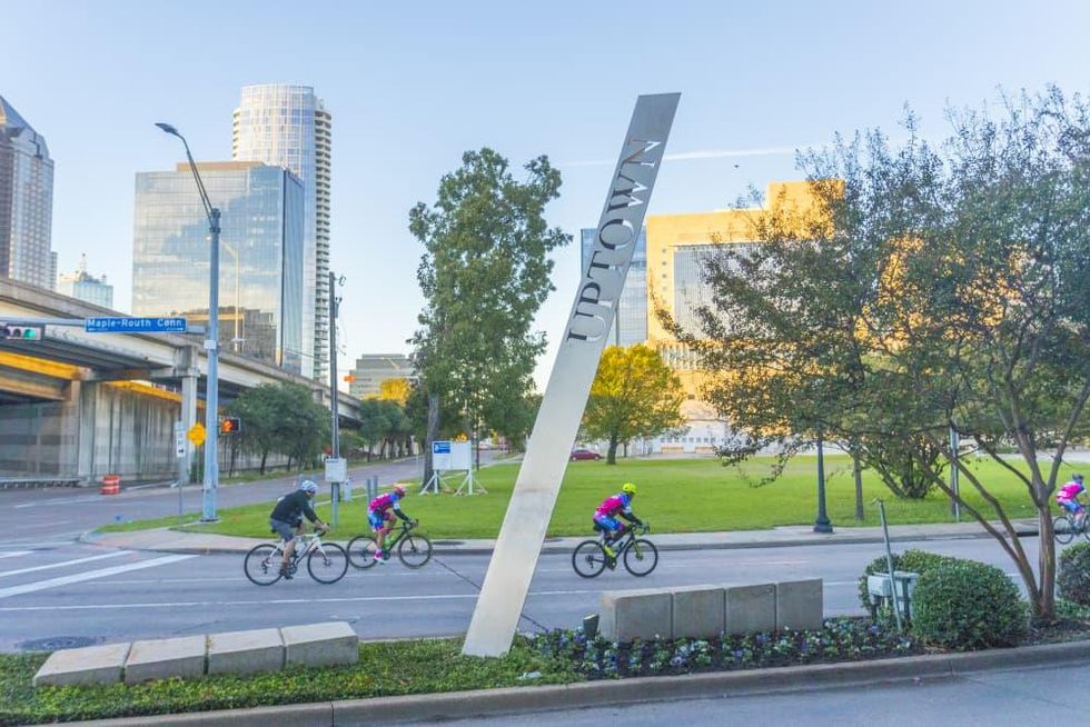 Bicyclists riding through Uptown Dallas