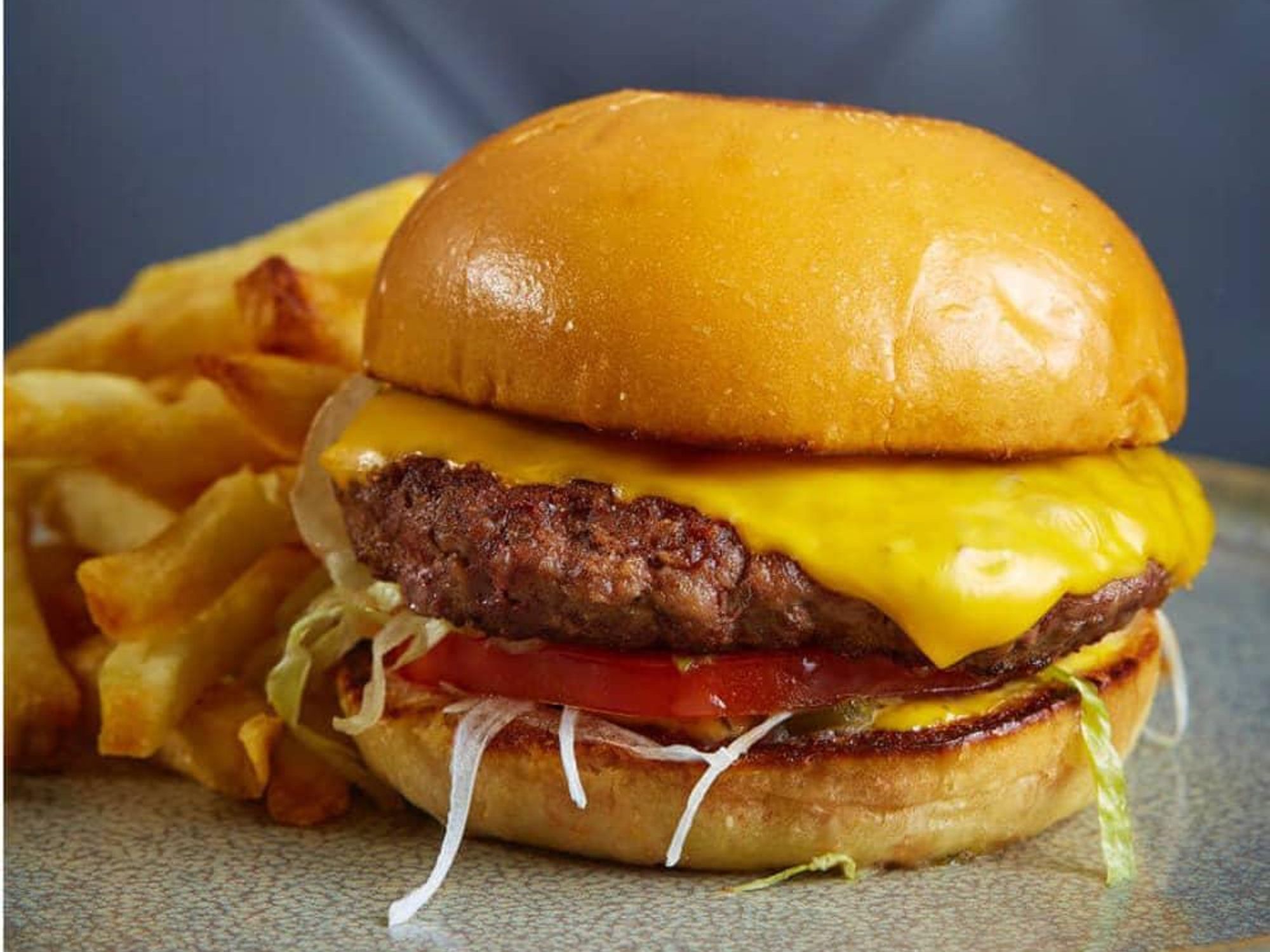 Burger with American cheese at Remedy