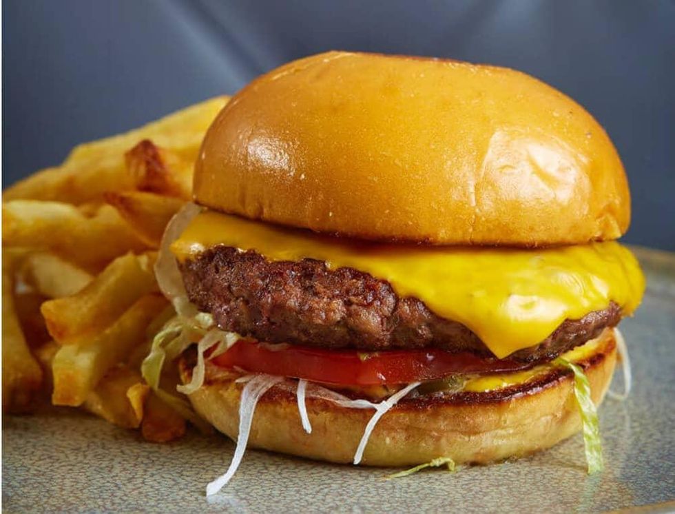 Burger with American cheese at Remedy