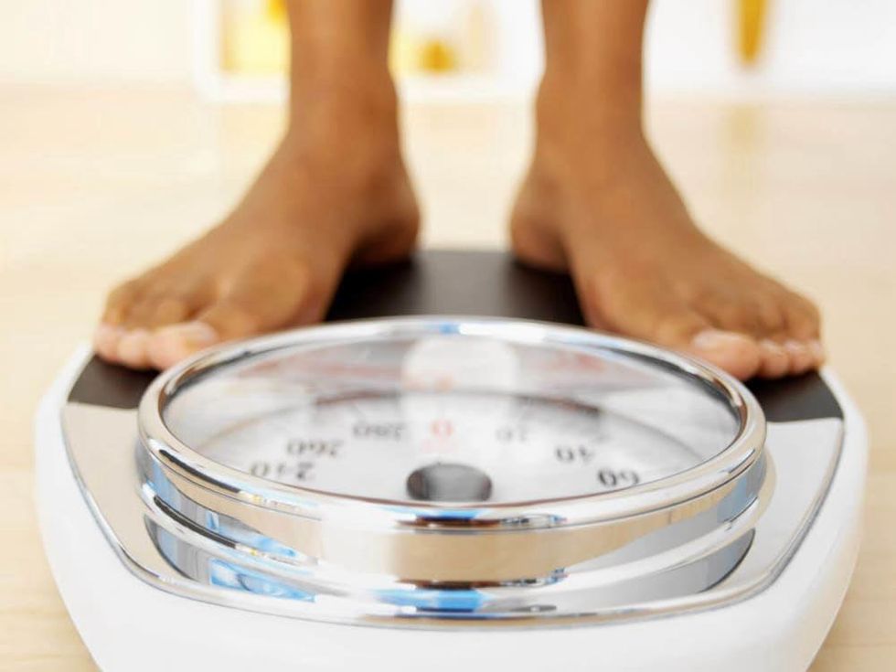 child's feet on a scale