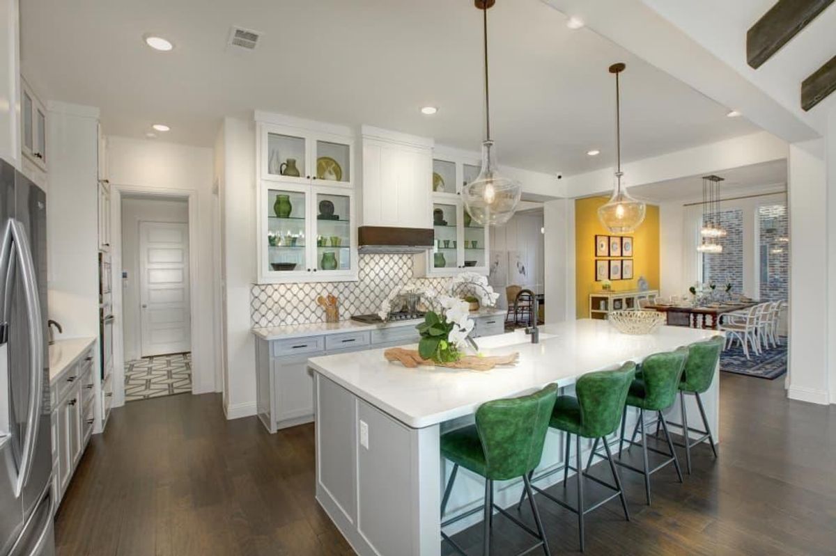Kitchen islands and smart home options, like in this kitchen from Drees