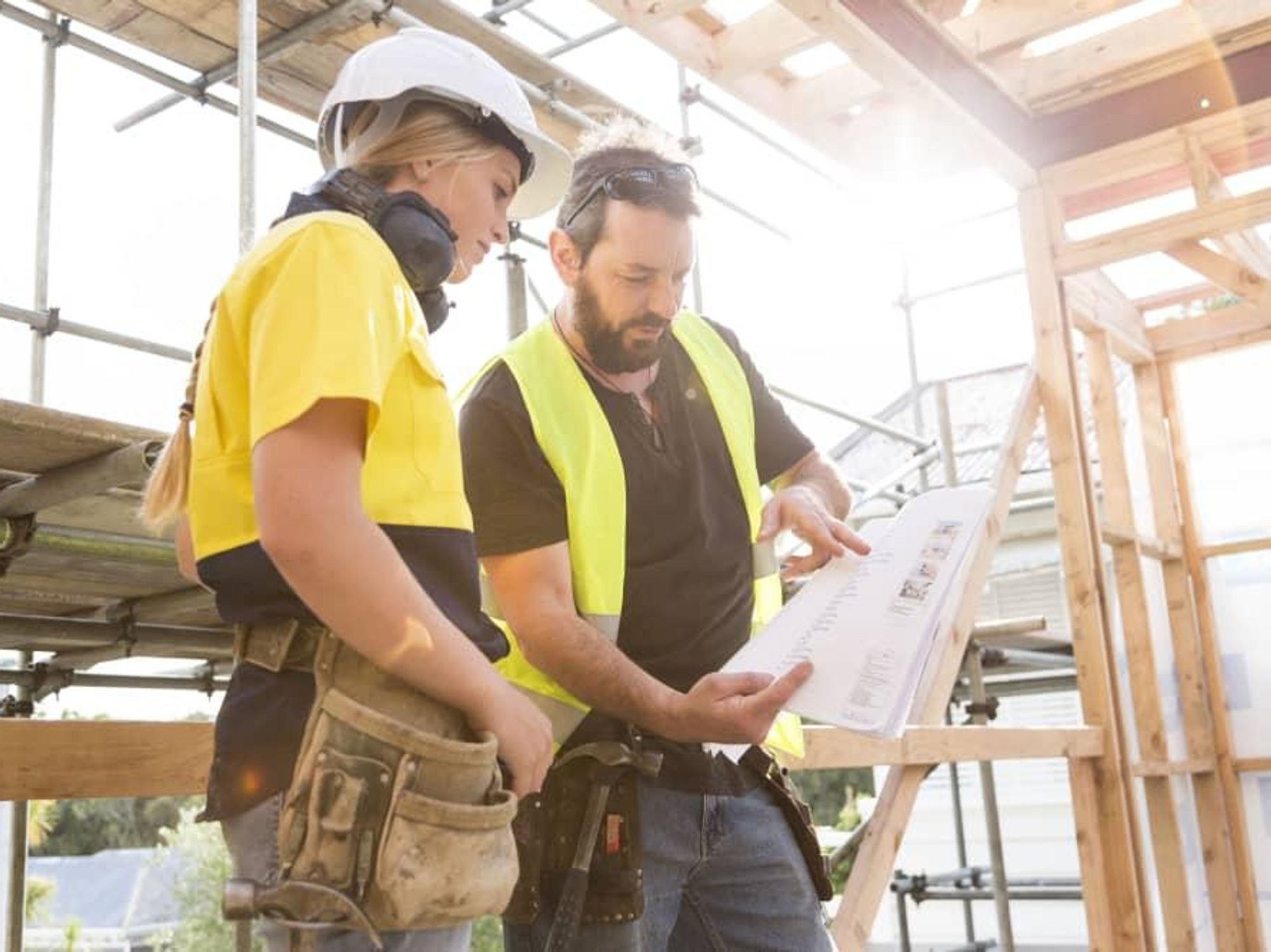 Construction workers building a house