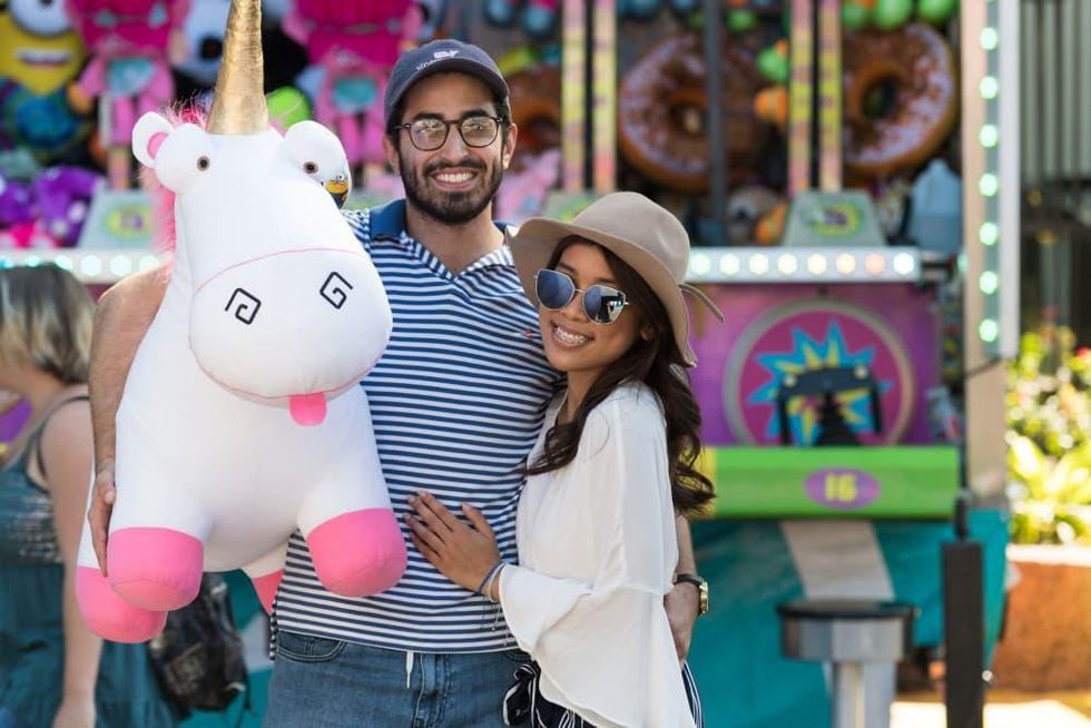 Couple holding a stuffed animal at the Midway