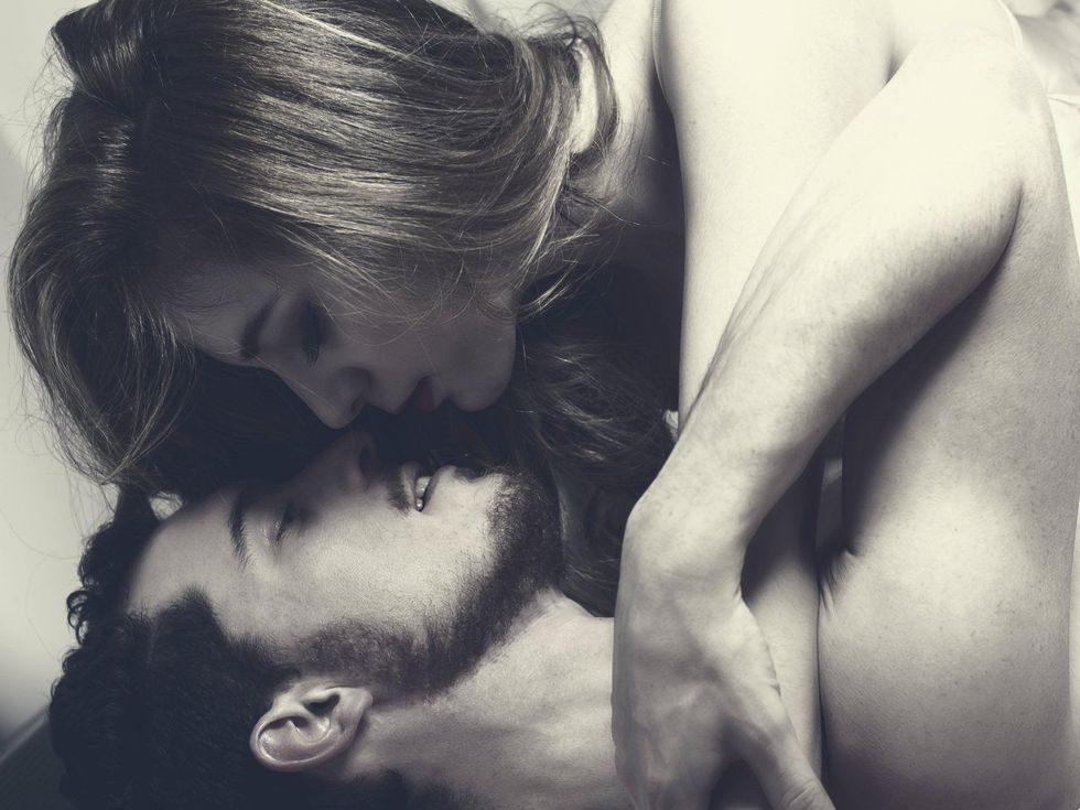 Couple kissing in bed