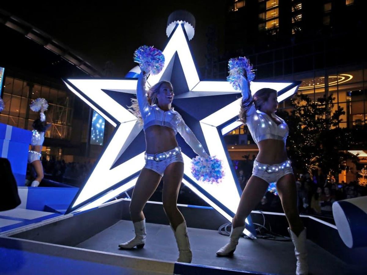 Even the cheerleaders light up during the Cowboys Christmas