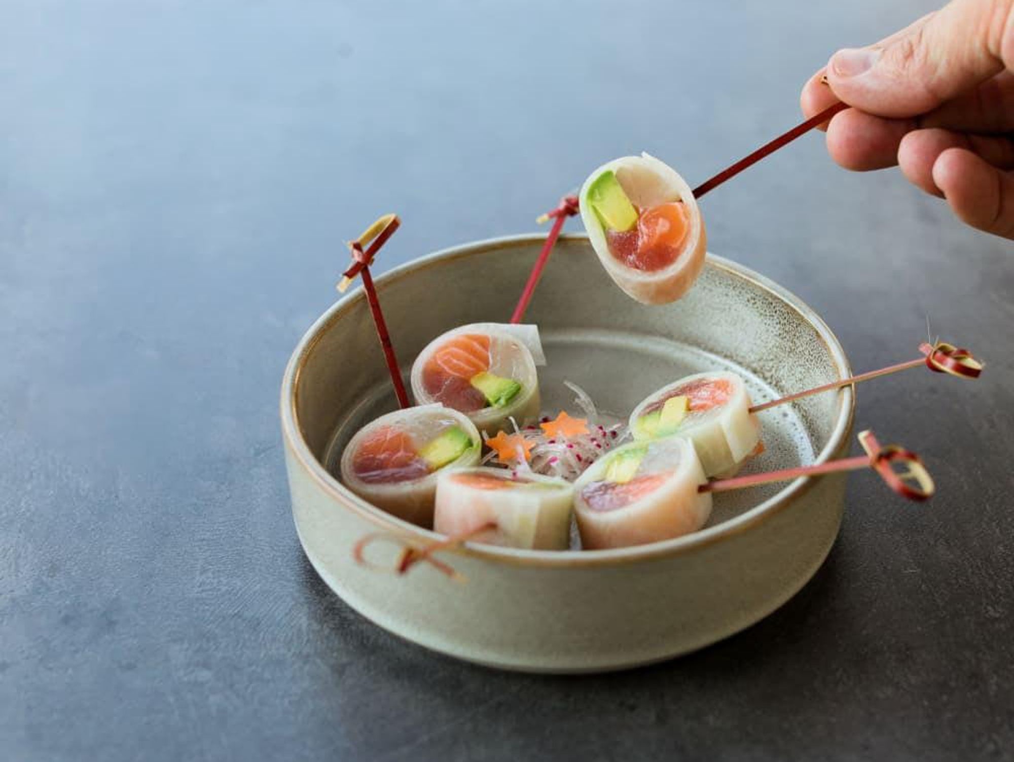 Cucumber sushi, enclosed in a thin sheet of cucumber.