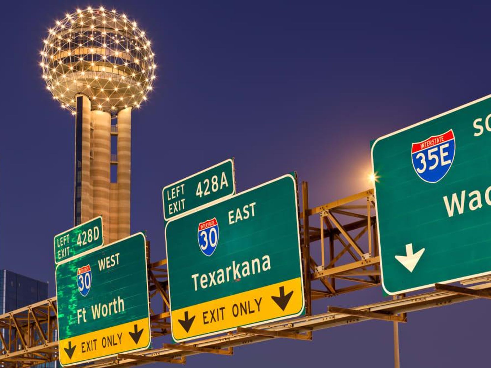 Dallas highway signs with Reunion Tower