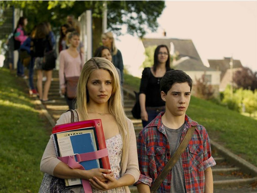 Dianna Agron and John D'Leo in The Family