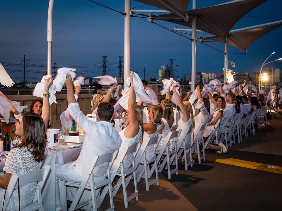 Secret Dallas party inspires 1,600 to dine in white on downtown bridge