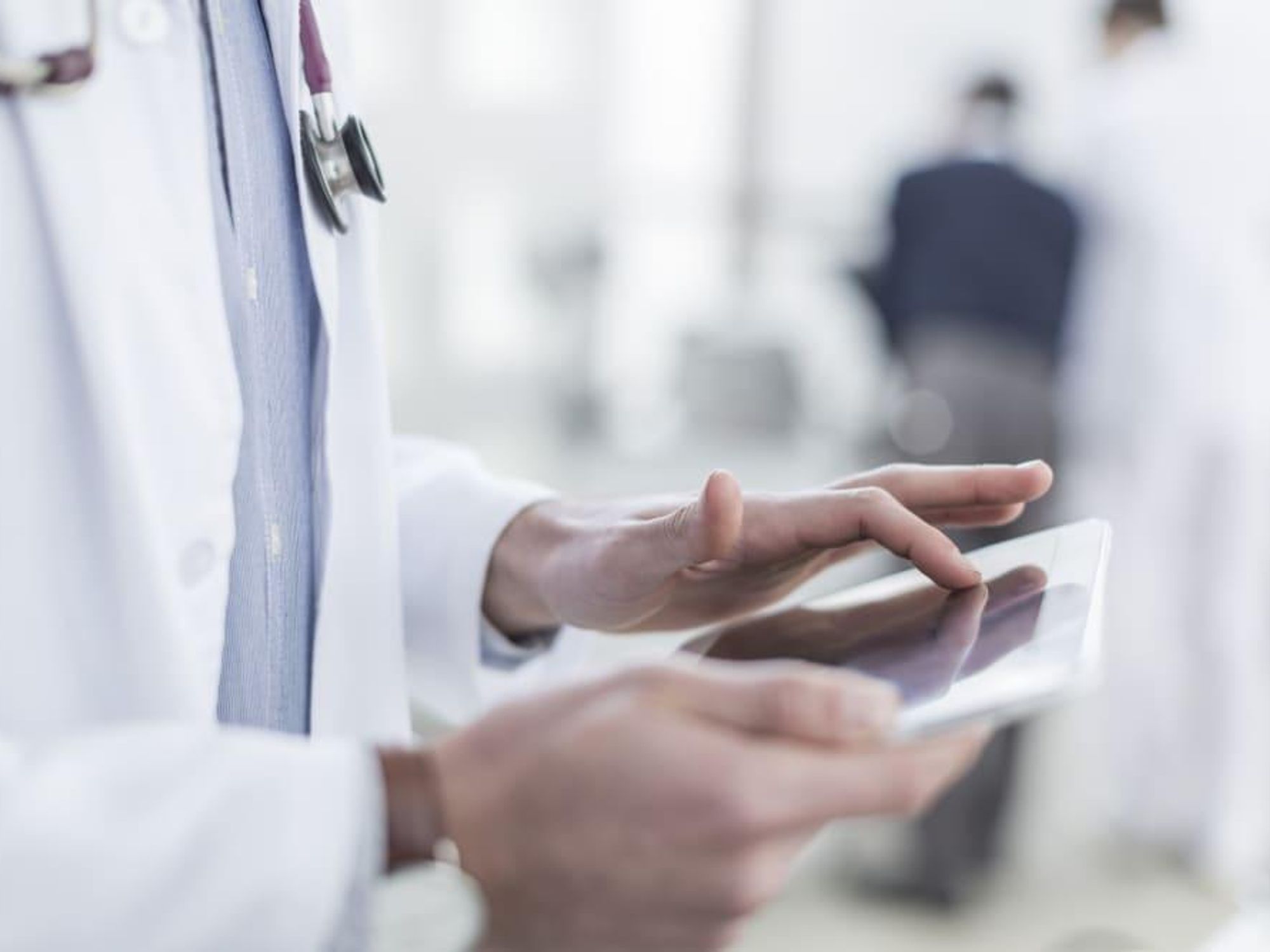 Doctor looking at a tablet