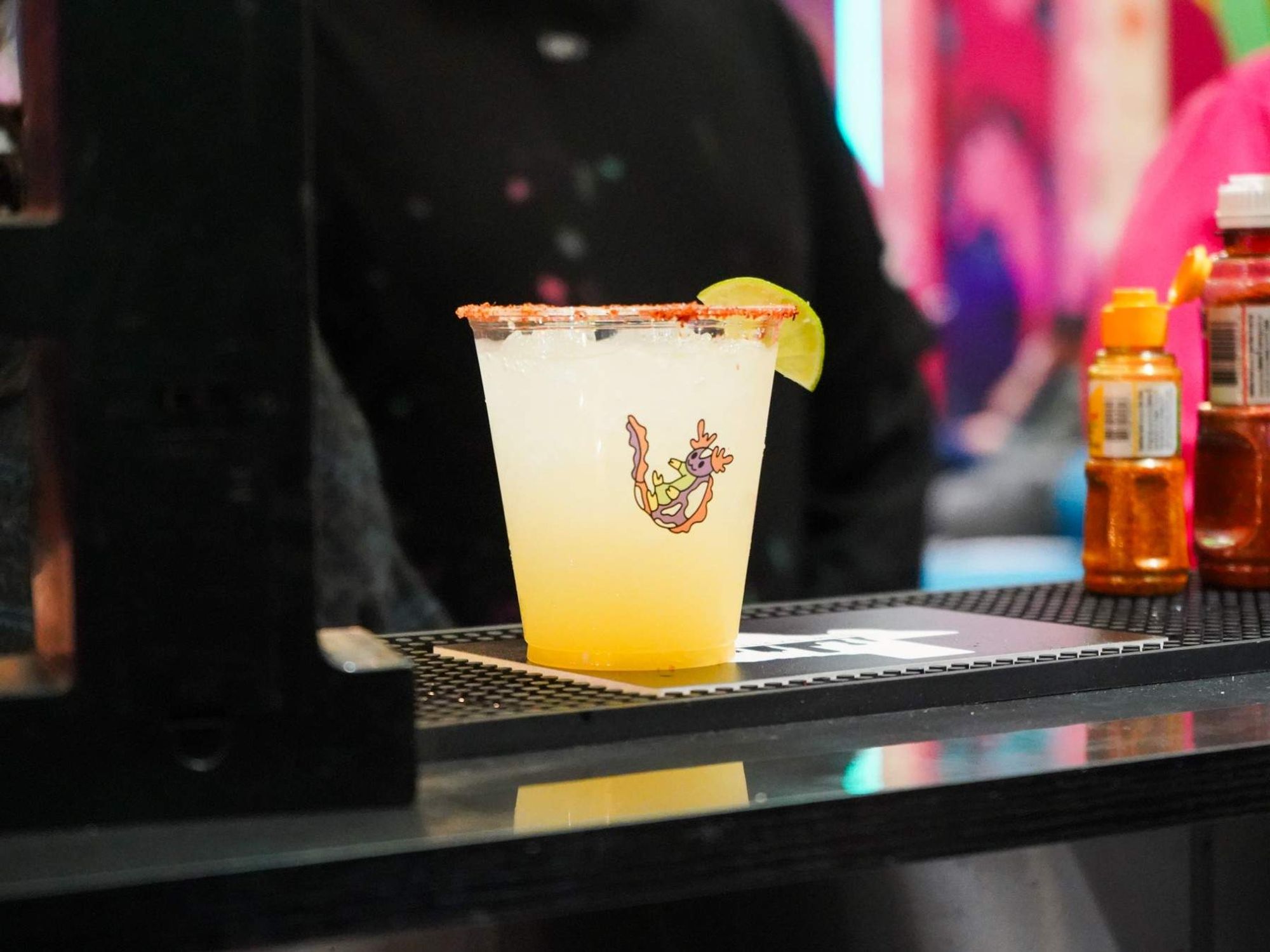 Drink at bar in Meow Wolf Grapevine