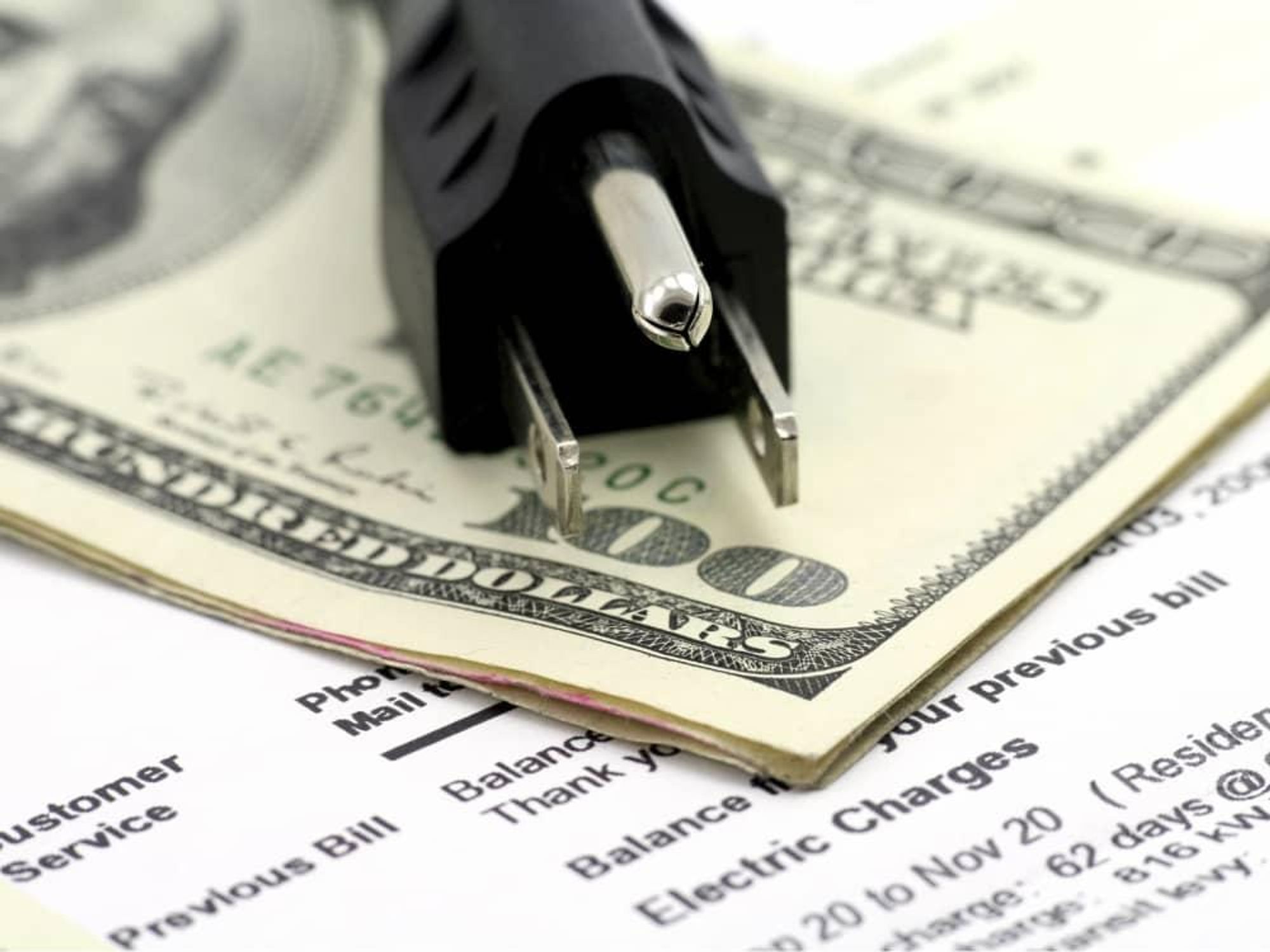 Electricity bill with plug and money