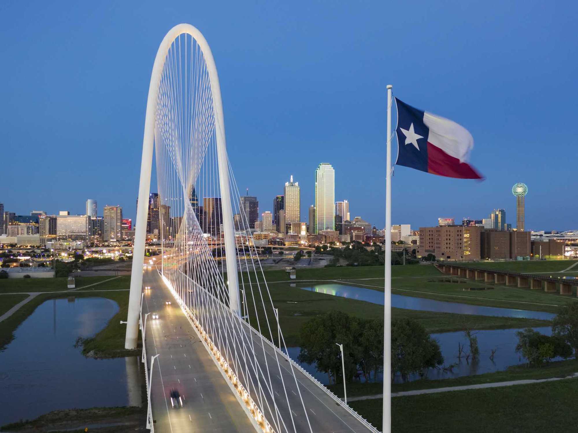 Elevated View of the Margaret Hunt Bridge and the Dallas Skyline at Dusk