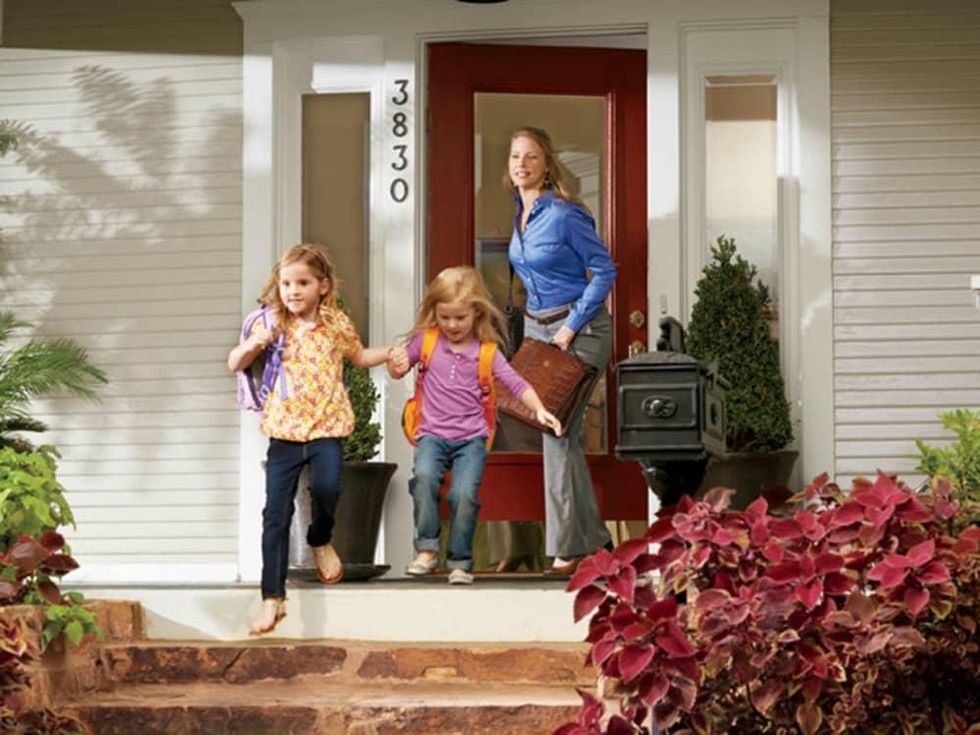 Family coming out of house