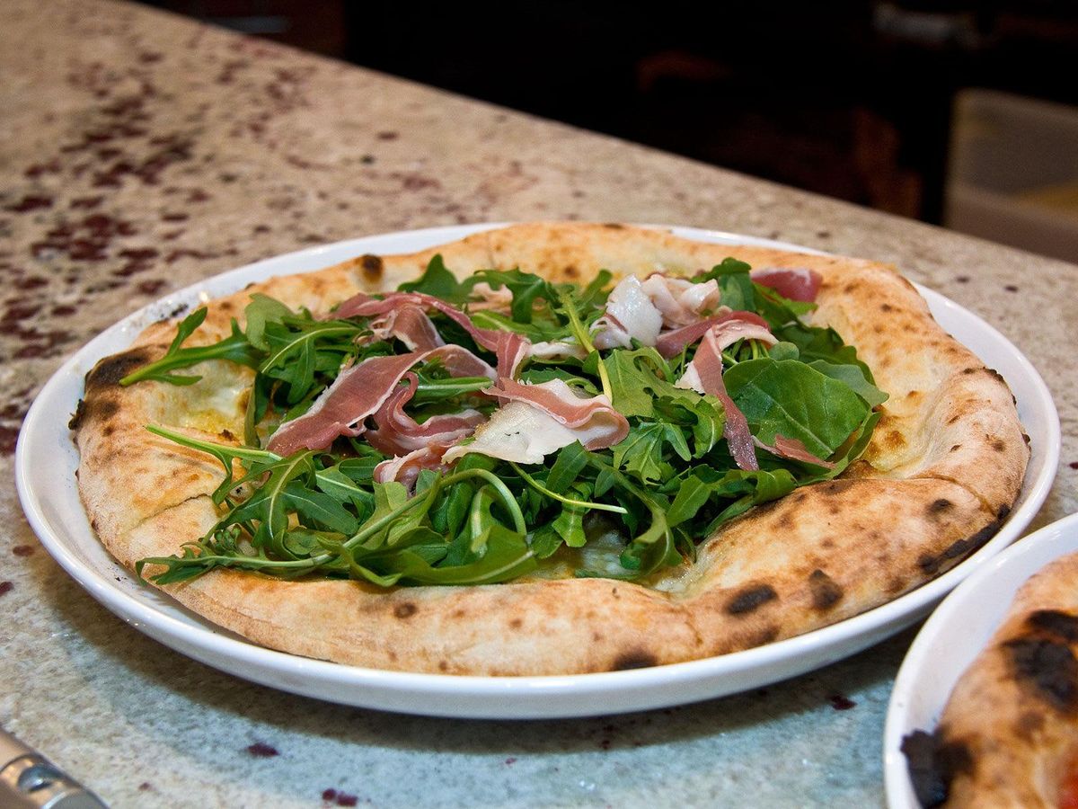 Firecrust pizza with prosciutto and arugula. - CultureMap Dallas