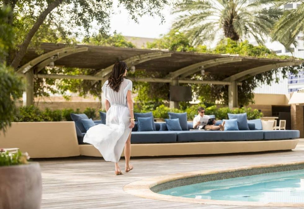 Four Seasons Houston pool woman walking spa