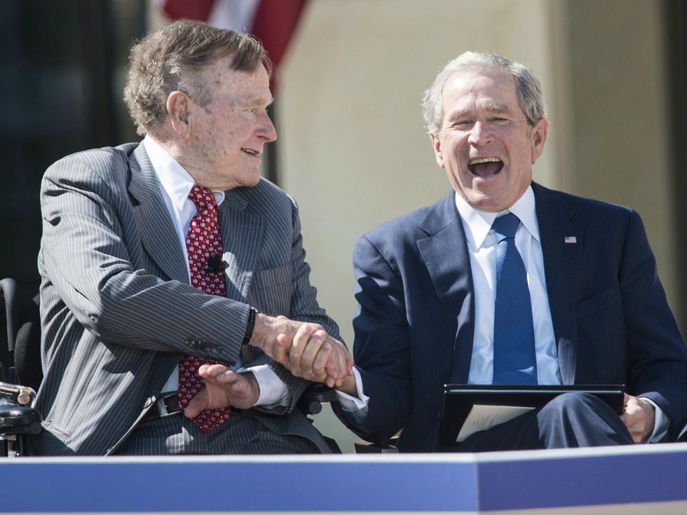 George H.W. Bush and George W. Bush at George W. Bush Presidential Center in Dallas