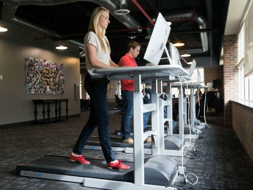 Girl at a treadmill desk