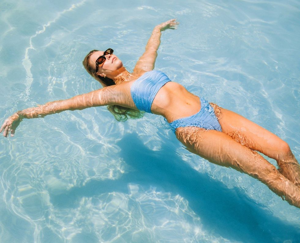 girl floating in pool