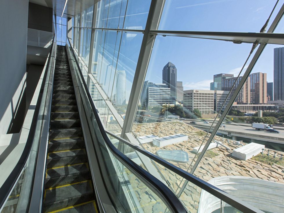 Glass-enclosed escalator at Perot Museum of Nature and Science in Dallas