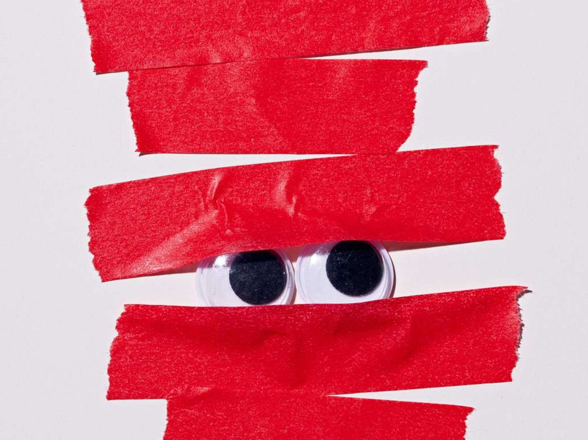 Googly Eyes Covered by Red Tape, Bureaucracy Concept