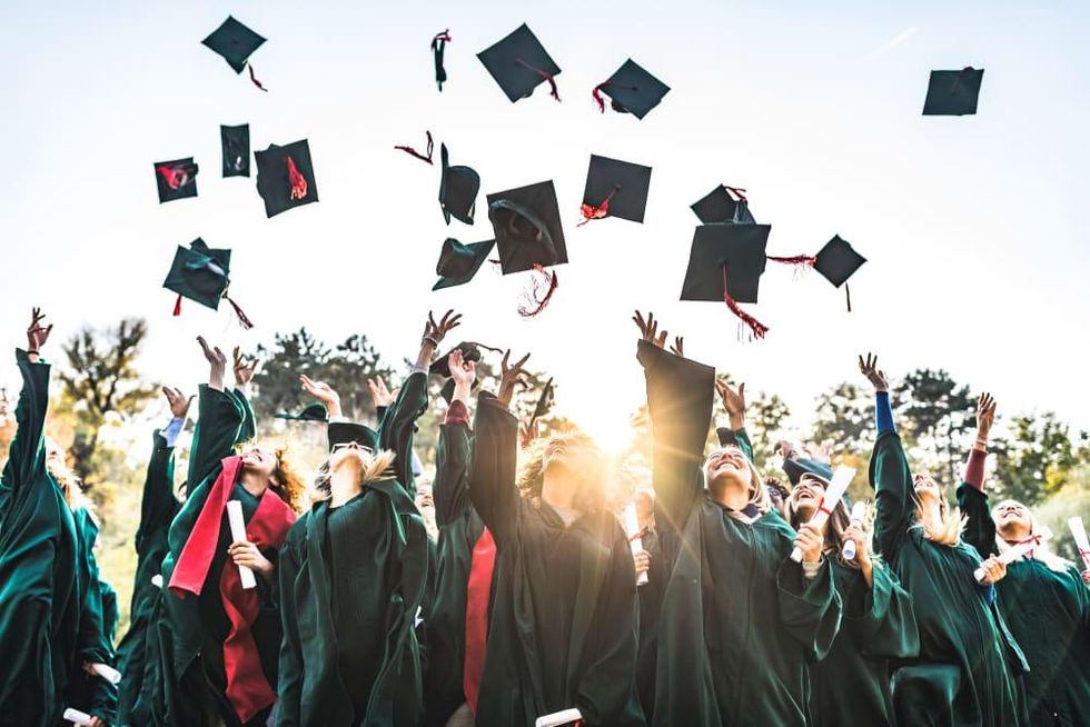 Graduates tossing their caps