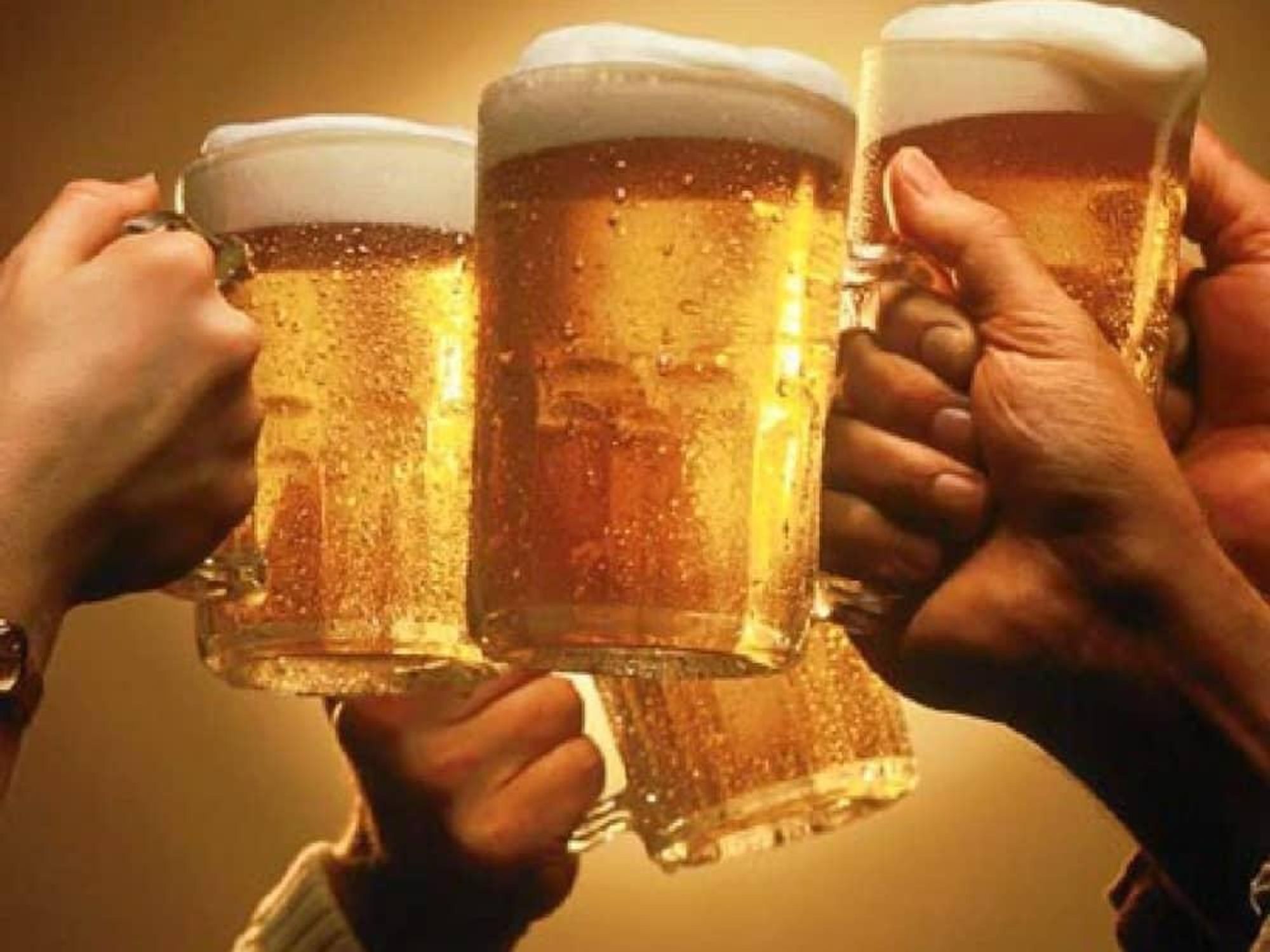 hands toasting with beer mugs
