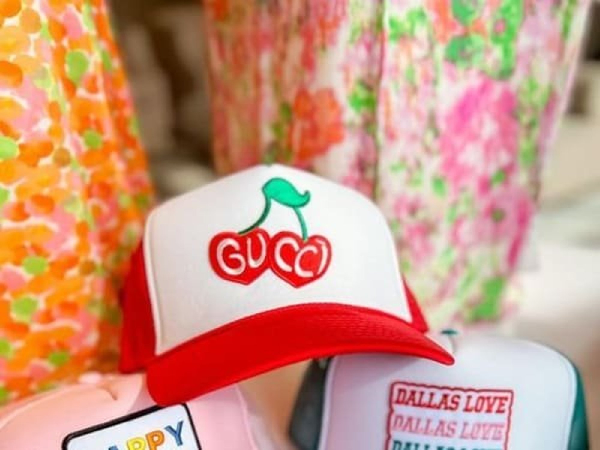 Hats and blouses on display in a boutique.