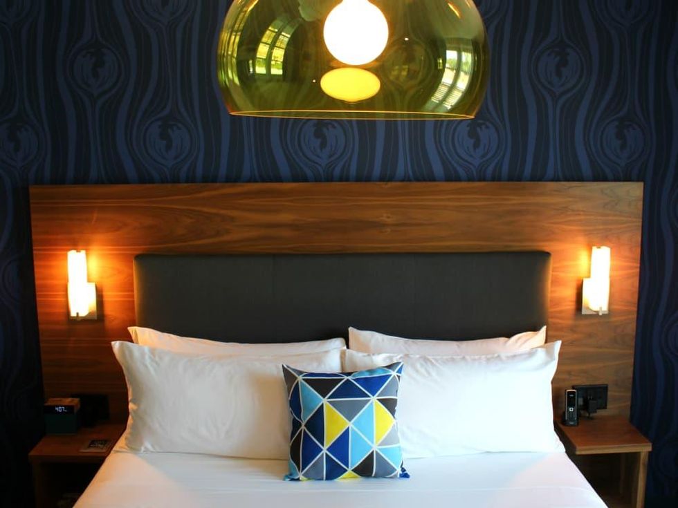 Hotel Eleven 11th Street Austin 2016 guest bedroom medium blue
