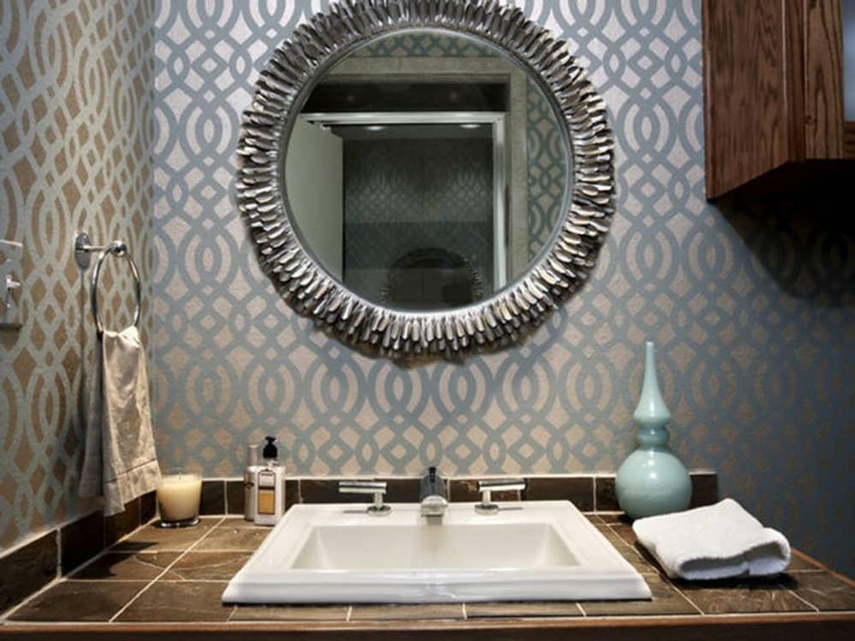 The Osborne and Little trellis wallpaper was the saving grace for a