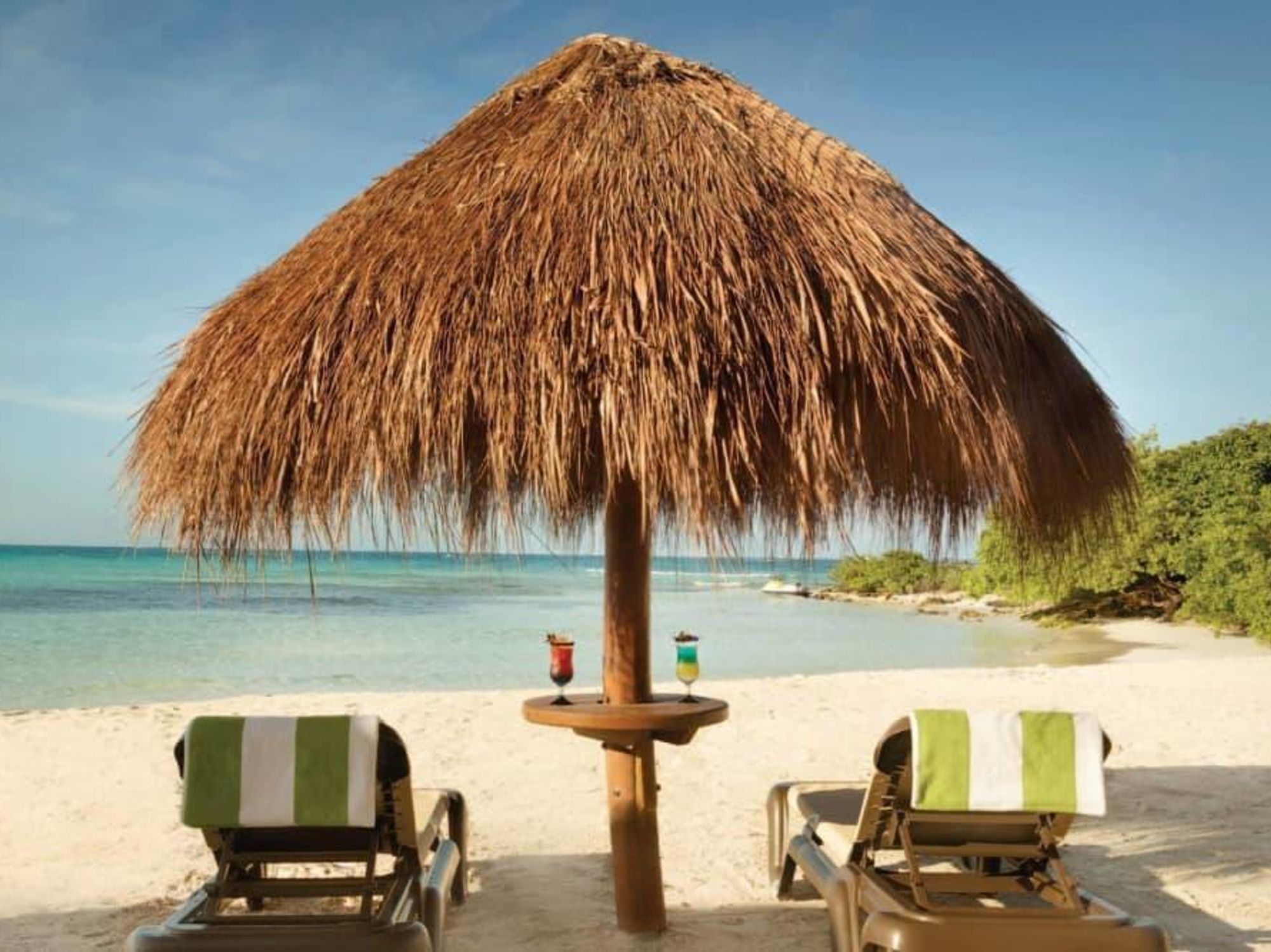 Hyatt Ziva Cancun beach chairs tropical drinks vacation