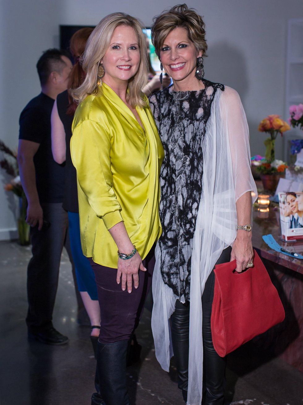 Janet Fresquez and Dawn Mellon, light the runway kickoff event