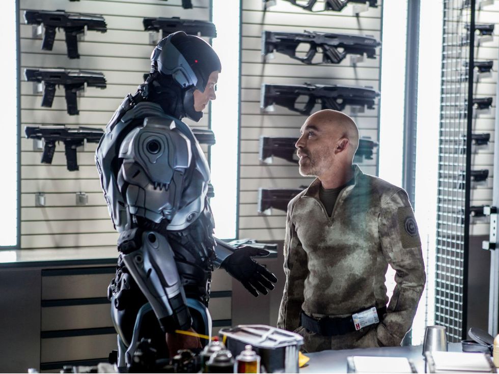 Joel Kinnaman and Jackie Earle Haley in Robocop