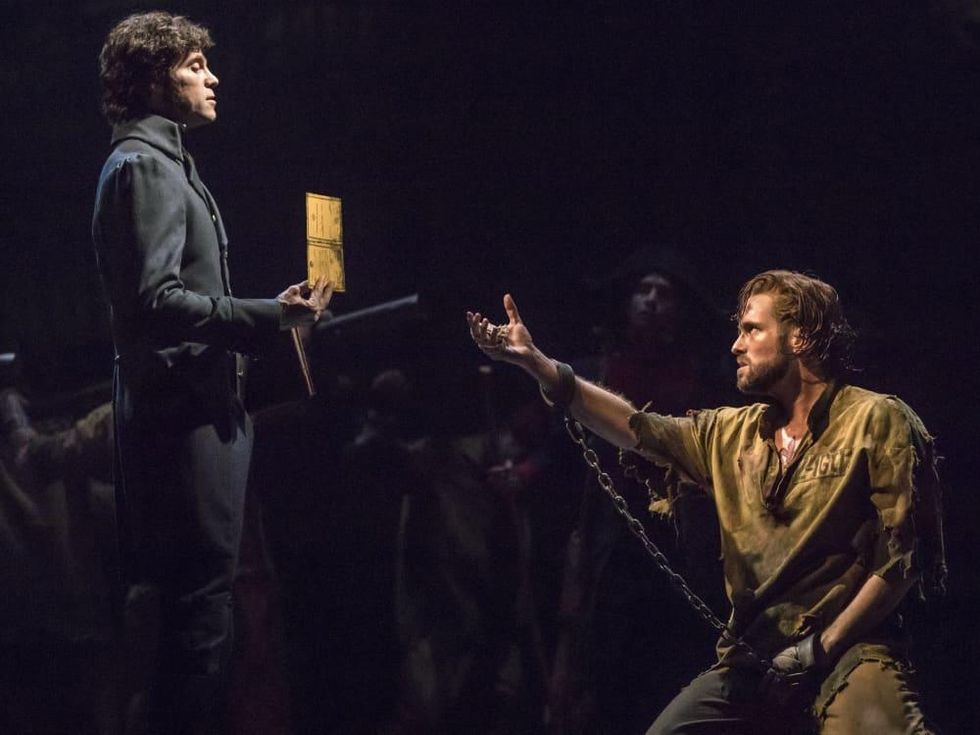 Josh Davis as Inspector Javert and Nick Cartell as Jean Valjean in the new national tour of Les Miserables
