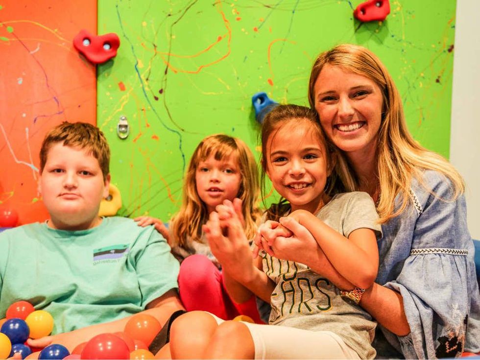 Katelyn Barbier-Mueller with children from Cornerstone Achievement Center