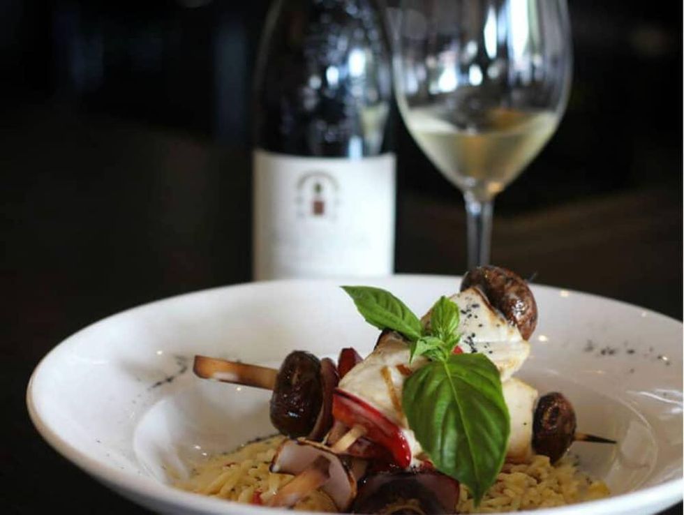 Kebabs and glass of wine at Sallio Bistro in Dallas