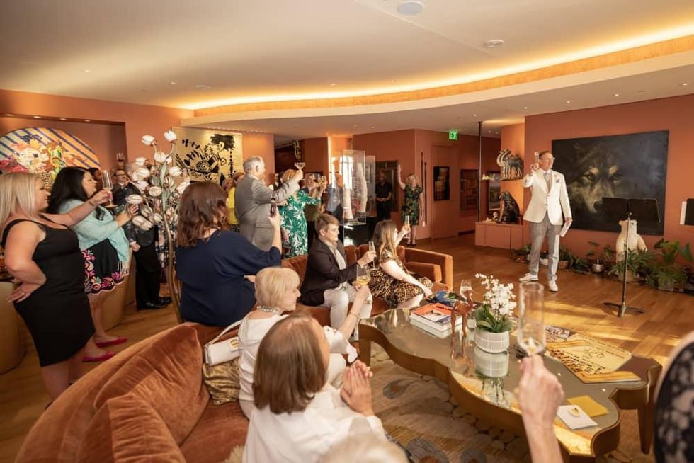 Ken Novice leads a toast