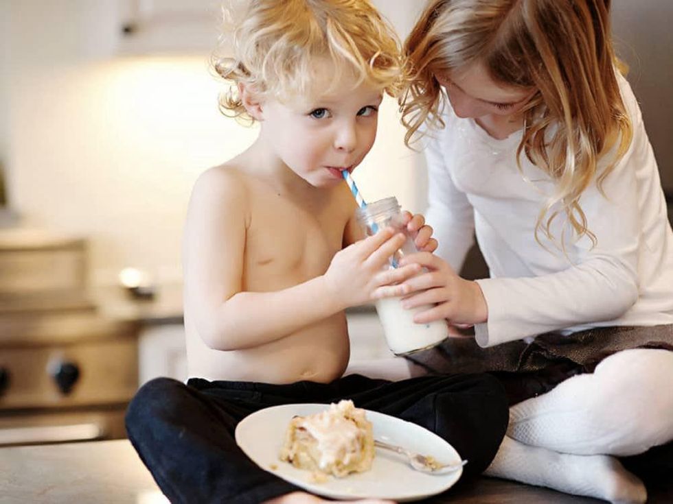 Kids eating RoRo's Cinn-A-Rolls