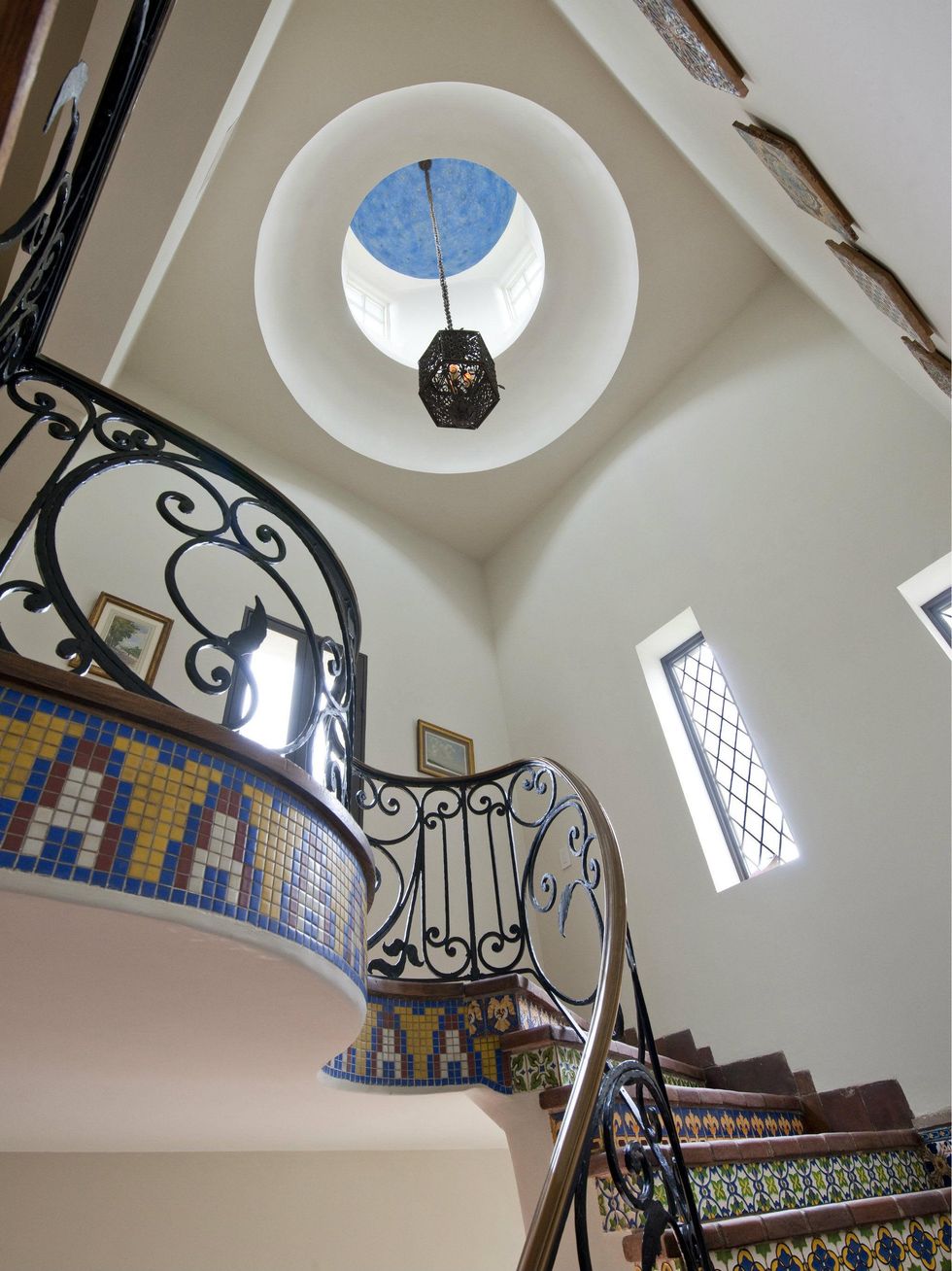 Light fixture over staircase