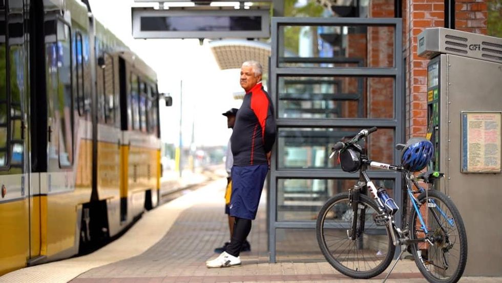 Man waits to board DART with his bike