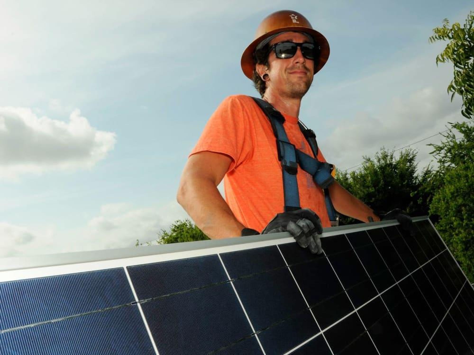 man with solar panels