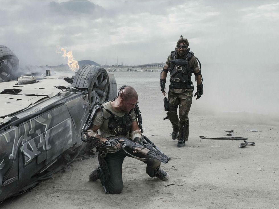 Matt Damon and Sharlto Copley in Elysium