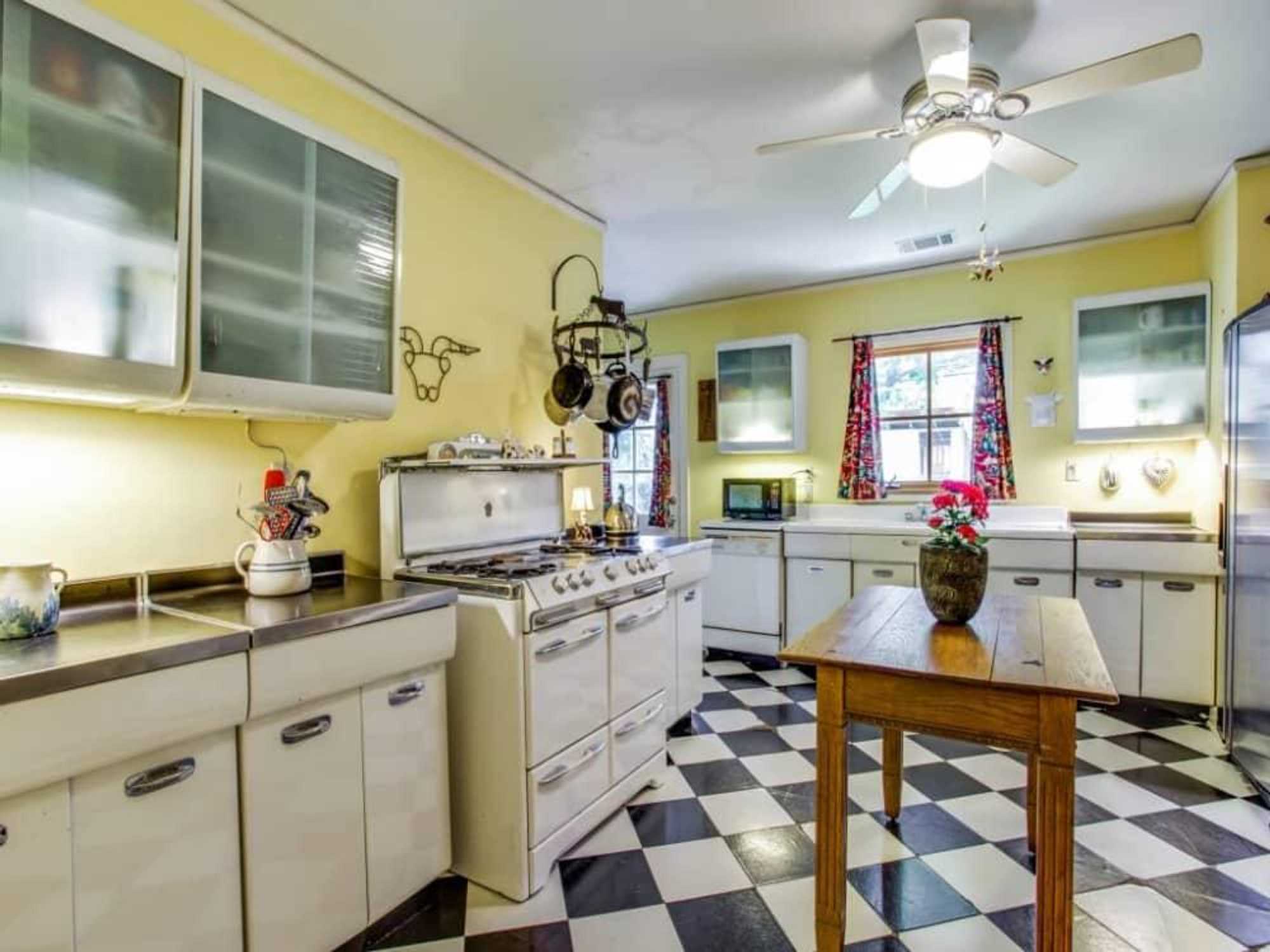 Midcentury stainless steel cabinets at 6469 Sondra Ln. in Dallas
