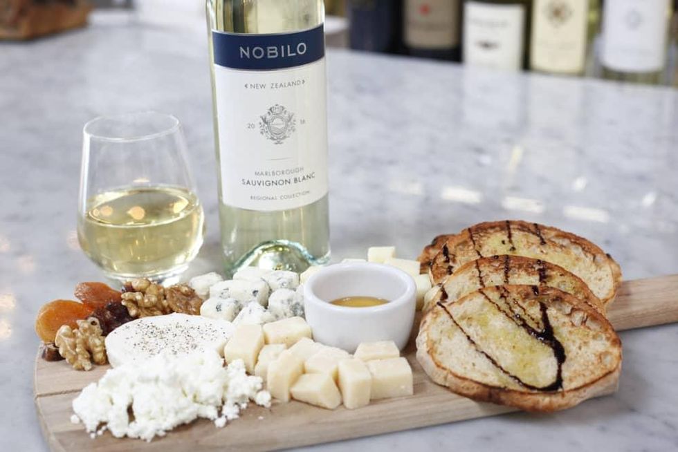 Midici cheese platter and bottle of wine